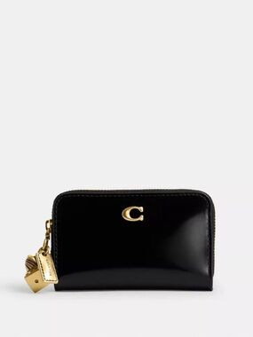 NWT Coach! Essential Small Zip Around Wallet
With Charms 🖤